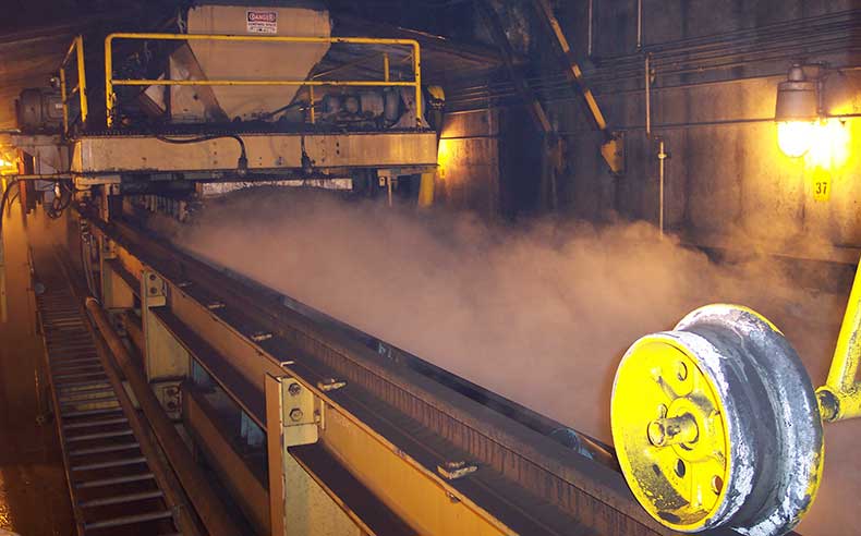 Conveyor transfer point dust control using Dry Fog